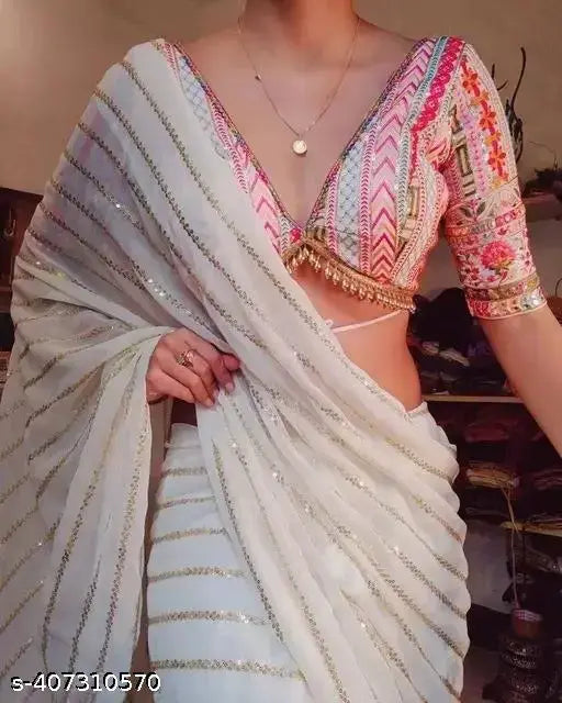 Heavy party wear Georgette saree with embroidered satin silk blouse, intricate sequin and net embroidery detail, Indian festive outfit on display