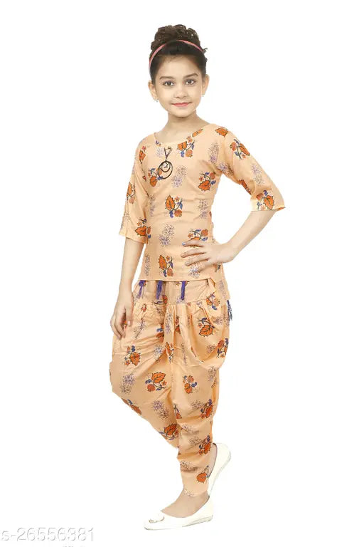 Girls Cotton Linen Orange A-line Top & Dhoti Pants Set, traditional yet contemporary blend. Quality cotton linen, comfortable elastic waistband, embroidery lace design. Versatile for festivals, cultural events, or family gatherings