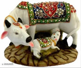 Marble dust polyresin Kamdhenu statue: Handcrafted Indian cow and calf decor
