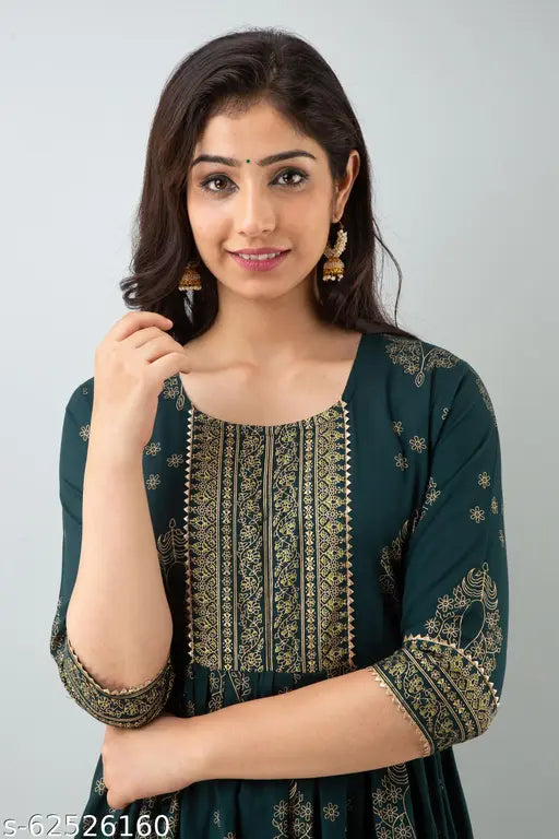 Red rayon festive kurta with printed combo, three-quarter sleeves. Model wearing size M (bust 38in, length 50in). Indian fashion