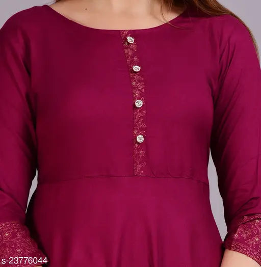 Solid rayon Anarkali kurta for women, three-quarter sleeves, single color design. Anarkali kurta on display stand." (120 characters)
