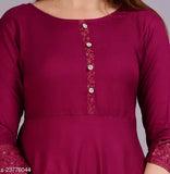Solid rayon Anarkali kurta for women, three-quarter sleeves, single color design. Anarkali kurta on display stand." (120 characters)