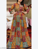 Exquisite orange rayon Anarkali gown for weddings & parties, heavily printed and fully flared, length up to 56 inches