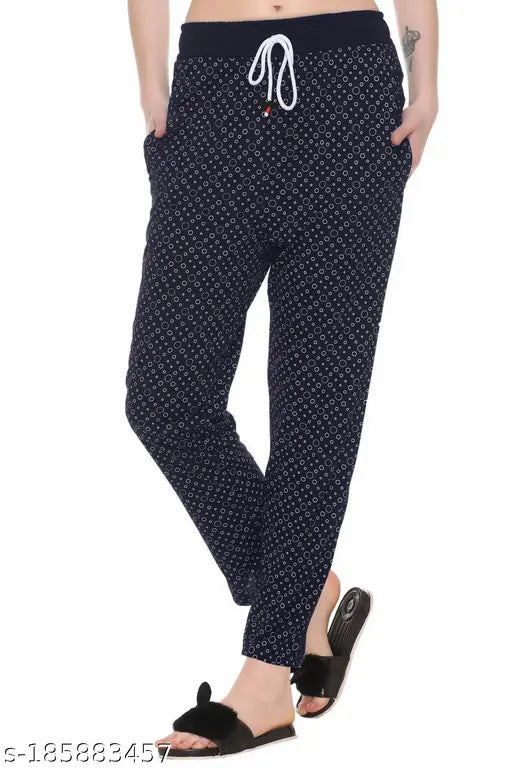 Soft cotton blend women's track pants by AFRONAUT, perfect fit for gym, yoga, running, and casual wear. Printed net pattern, available in sizes 28-36. Comfortable loungewear with secure zipper pockets. Made in India