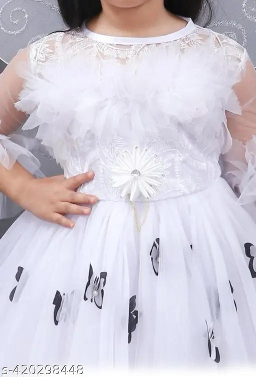 White net fit & flare party dress for girls, complete with hair band, fairy wings, and fairy stick. Embellished net design, three-quarter sleeves. Size range: 2-3 Years - 8-9 Years. Transform any celebration into a fairy-tale extravaganza