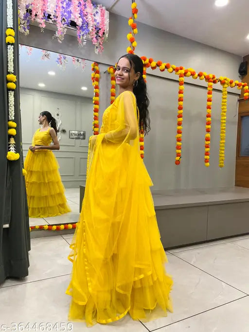 Cotton net lehenga with choli and dupatta, embroidered work in latest Indian designer bridalwear. Semi-stitched, ready to ship." (109 characters)