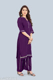 Women's rayon regular fit mirror work kurti plazzo set, solid color with three-quarter sleeves and palazzo bottoms on display