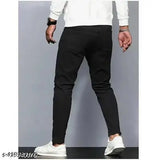 Black stretchable slim fit denim jeans for men, made from solid cotton blend denim. Perfect for casual wear and versatile style upgrade