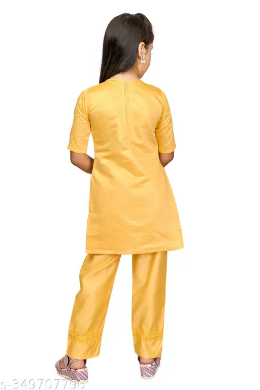 Yellow Chanderi cotton embroidered kurta set for girls, straight top with three-quarter sleeves, suitable for 4-10 year olds, Indian traditional clothing on display