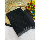 Black Georgette stone work saree with unstitched blouse, intricate patterns on display