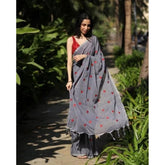 Grey linen printed saree with unstitched blouse, vibrant pattern detail on display