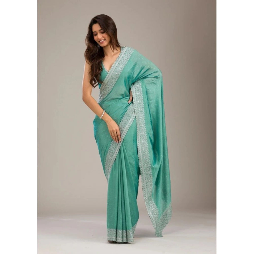 Light green silk embroidered saree with unstitched blouse, intricate detailing on display