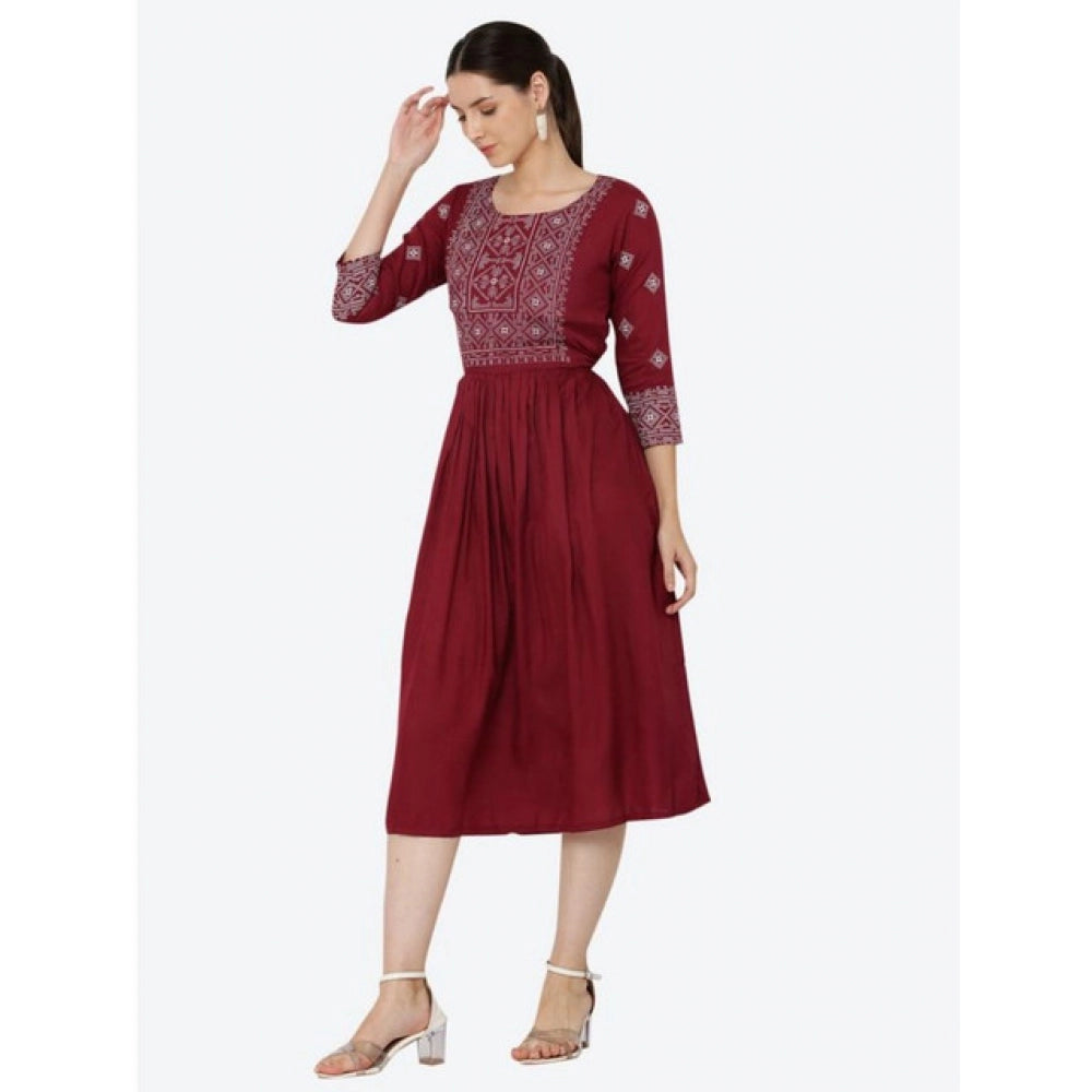 Maroon rayon printed kurti with 3/4th sleeves on hanger