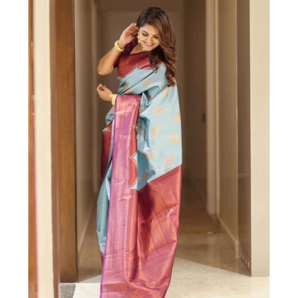 Light-blue soft lichi silk printed saree with unstitched blouse, stylish Indian wear for women on model