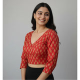 Red Ajrakh cotton printed halter neck padded blouse with long sleeves on hanger