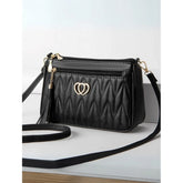 Black PU leather sling bag, medium size with zipper closure for women's fashion accessory