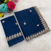 Blue georgette embroidered saree with unstitched blouse (5.5mtr) on mannequin