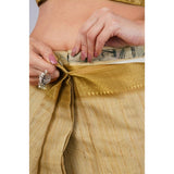 Gold polyester printed ready-to-wear saree with unstitched blouse (5.5 mtr) on mannequin