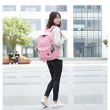 Pink PU Leather Medium Backpack with adjustable straps and zipper closure