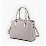 Grey PU Leather Solid Shoulder Handbag with adjustable strap and zipper closure, dual handle design