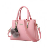 Pink PU Leather Solid Handbag with 2 compartments, adjustable-removable strap, and zipper closure