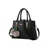 Black PU leather solid shoulder handbag with adjustable-removable strap, inner polyester lining, and zipper closure