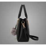 Black PU leather shoulder handbag with 3 compartments, polyester lining, adjustable & removable strap, and zipper closure