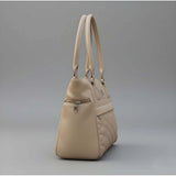 Beige PU leather shoulder handbag with adjustable strap, zipper closure, and dual handle. Polyester lining, 4 compartments design