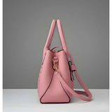 Pink PU leather solid shoulder handbag with 2 compartments, adjustable-removable strap, and zipper closure