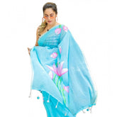 Light blue linen printed saree with unstitched blouse, vibrant pattern on traditional Indian wear
