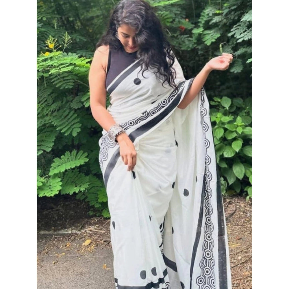 White linen printed saree with unstitched blouse, traditional Indian attire for women on mannequin