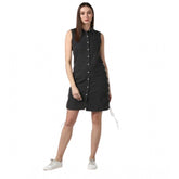 Black denim women's sleeveless dress with shirt collar neck, solid pattern above knee length, button closure