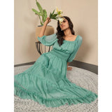 Green chiffon puff sleeve dress, solid pattern, zip closure on mannequin
