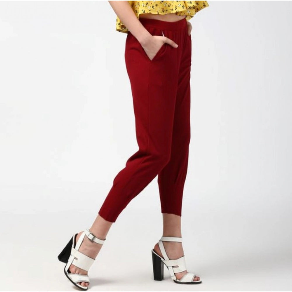 Maroon polyester elastic trousers for women, solid pattern, ankle length with elastic closure