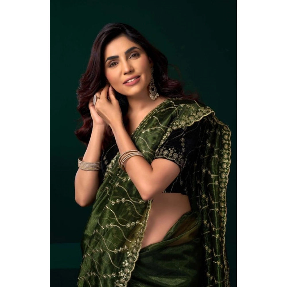Light green net sequence saree with unstitched blouse, intricate pattern detail on display