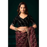 Maroon net sequence saree with unstitched blouse, intricate patterns on flowing fabric for traditional Indian wear