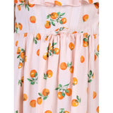 Orange rayon printed sleeveless dress for girls, vibrant floral pattern on a casual summer outfit