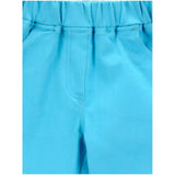 Blue denim girl's jeggings with elastic waist, solid patterned design