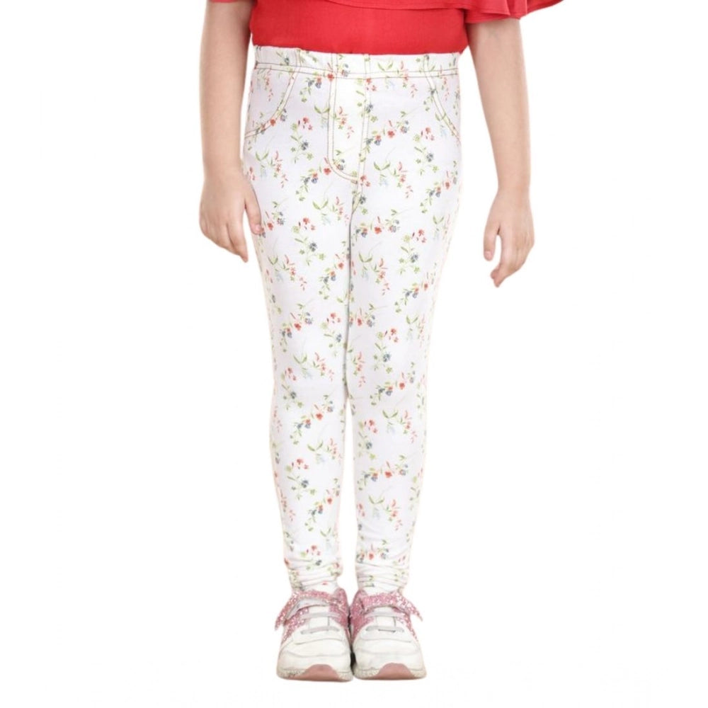 White-green floral elasticated cotton lycra jeggings for girls, featuring a vibrant floral pattern