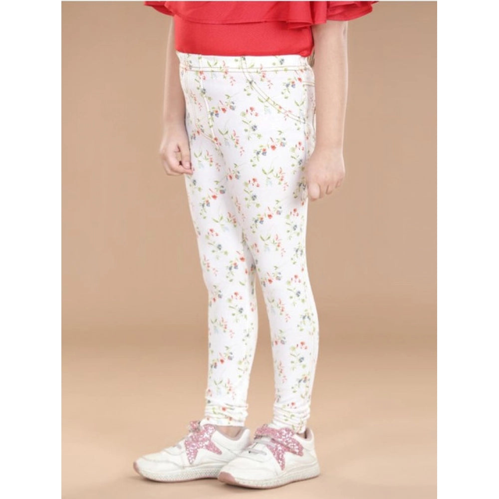 White-green cotton lycra floral elasticated jeggings for girls, casual wear with floral pattern