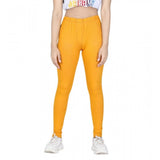 Mustard cotton lycra elasticated jeggings for girls, solid pattern on display