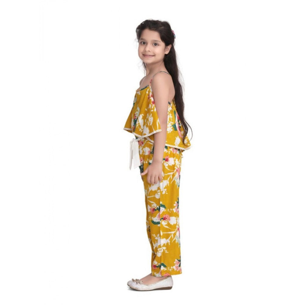Mustard rayon floral jumpsuit for girls with shoulder straps, vibrant floral pattern