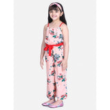 Peach-red floral polyester crepe girl's jumpsuit with shoulder straps, square neckline on model