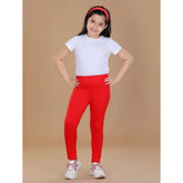 Red cotton lycra elasticated leggings for girls - solid pattern, comfortable athletic wear
