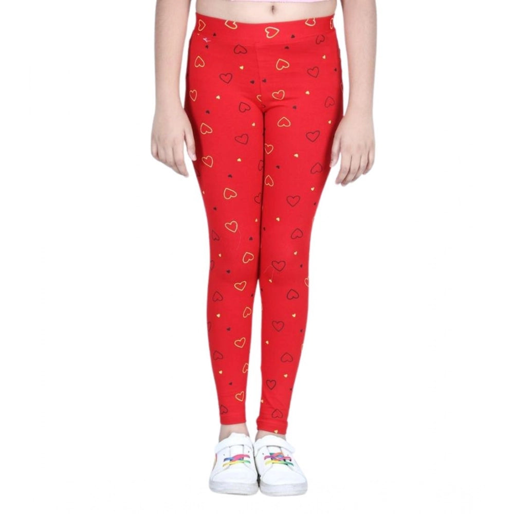 Red cotton lycra printed elasticated leggings for girls, vibrant pattern detail