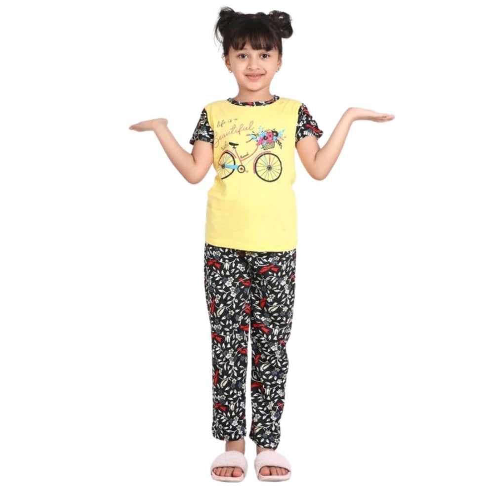 Yellow-black cotton hosiery girl's printed night suit set on model