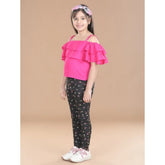 Pink cotton floral elasticated jegging and top set for girls, featuring a floral pattern and shoulder straps on the top
