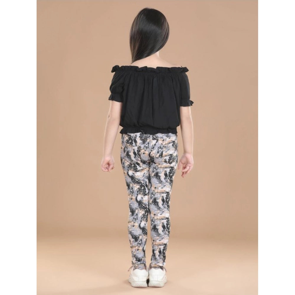 Black cotton floral elasticated jegging and top set for girls, featuring floral print on both pieces with elastic waist and shoulder straps