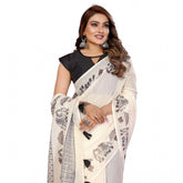Off-white linen cotton printed saree with unstitched blouse, intricate design details visible on display stand