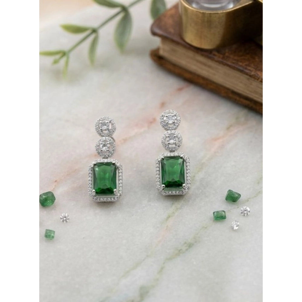 Women's green brass silver-plated drop earrings on display, jewelry accessories for special occasions